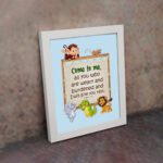 Bible verse wall art for kids with Matthew 11:28 and cartoon animals on a light blue background. displayed on the wall in a white frame