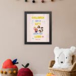 Christian wall art with happy children holding hands and Psalm 127:3 text 'Children are a gift from the Lord. displayed on the wall in a black frame