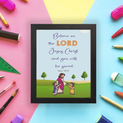 Wall art with a green field, trees, and cartoon figures of Jesus and children, featuring the text 'Believe in the Lord Jesus Christ, and you will be saved. displayed on the wall in a black frame in a colorful background