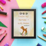 Artwork of a baby deer with flowers and the verse God knew me before I was born in warm colors. Perfect for children's decor. displayed on the wall in a black frame in a colorful background