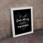 For With God, Nothing Shall Be Impossible Luke 1:37 Christian Bible Verse Wall Art on black background with bold white text. displayed on the wall in a white frame