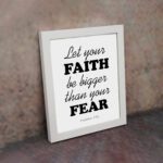 Let Your Faith Be Bigger Than Your Fear Hebrews 13:6 Christian Wall Art in black text on white background for home decor. displayed on the wall in a white frame