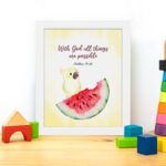 With God, All Things Are Possible Matthew 19:26 Bible Verse Wall Art featuring a bird and watermelon design for kids. displayed on the table in a white frame