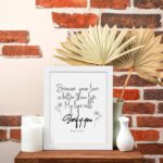 Wall art design with the text Because Your Love Is Better Than Life, My Lips Will Glorify You from Psalm 63:3. displayed on the table in a white frame