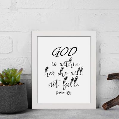 God Is Within Her, She Will Not Fall Psalm 46:5 Christian wall art with black lettering on a white background. displayed on the wall in a white frame