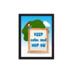 Keep Calm and Hop On a wooden sign with a girl, blue sky, and tree - General Verse Wall Art for kids. hung on the wall in a black frame