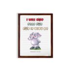 Cartoon elephant with a raised trunk and colorful text I Will Not Fear For God Is With Me - Isaiah 41:10 Bible Verse Wall Art. hung on the wall in a brown frame