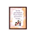 Wall art depicting Jesus as the Good Shepherd with children, featuring the verse I am the good shepherd from John 10:11. hung on the wall in a brown frame