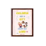 Christian wall art with happy children holding hands and Psalm 127:3 text 'Children are a gift from the Lord. hung on the wall in a brown frame