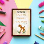 Artwork of a baby deer with flowers and the verse God knew me before I was born in warm colors. Perfect for children's decor. displayed on the wall in a brown frame in a colorful background