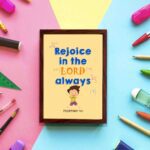 Rejoice in the Lord always, Philippians 4:4 Christian wall art with smiling child and bright colors. displayed on the wall in a brown frame in a colorful background