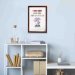 Cartoon elephant with a raised trunk and colorful text I Will Not Fear For God Is With Me - Isaiah 41:10) Bible Verse Wall Art. displayed on the wall in a brown frame