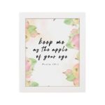 Keep Me As The Apple Of Your Eye Psalm 17:8 Bible Verse Wall Art with apple and leaf design, soft pastel colors, and white background. Wall Art hung on the wall in white frame