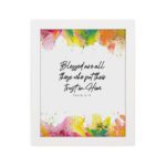 Vibrant Bible wall art with Psalm 2:12 verse and colorful paint splash in green, yellow, pink, and orange. Wall Art hung on the wall in a white frame