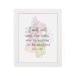 Psalm 18:3 Bible Wall Art with a soft pastel background and light green and beige leaves, featuring dark, elegant text. Wall Art hung on the wall in white frame