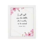 I Will Call Upon The Lord Psalm 18:3 Bible Verse Wall Art with black text on a white background, featuring pink floral decorations in the corners. Wall Art hung on the wall in a white frame