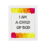 Infidu I Am A Child Of God Bible Wall Art with colorful watercolor borders and black block text on a white background Wall Art hung on the wall in a white frame