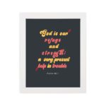 Psalm 46:1 Bible Wall Art with bold, colorful text on a deep black background. Wall Art hung on the wall in a white frame