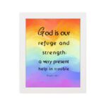 Psalm 46:1 Bible Wall Art with black vertical text on a vibrant rainbow gradient background. Wall Art hung on the wall in a white frame