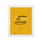 Bright mustard yellow wall art with Psalm 52:1. God in gold and playful font with star-like designs. Wall Art hung on the wall in a white frame