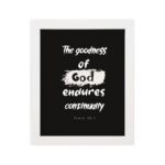 Infidu The Goodness Of God Endures Continually Psalm 52:1 Christian wall art with bold white text on a black background. Wall Art hung on the wall in a white frame