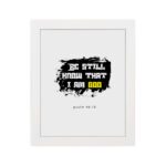 Be Still and Know That I Am God Psalm 46:10 Christian wall art with handwritten text on a navy blue background. Wall Art hung on the wall in a white frame