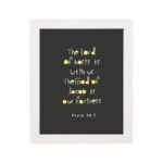 Psalm 46:7 Bible Verse Christian Wall Art - The Lord of Hosts is With Us, Minimalistic Design with Gold Accents. hung on the wall in a white frame