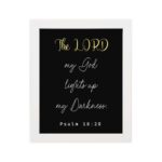 Psalm 18:28 Bible verse wall art with The LORD in yellow on a black background. Christian decor by Infidu. Wall Art hung on the wall in a white frame