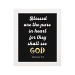 Bible verse wall art with black background, yellow and white font, featuring Matthew 5:8 verse white frame hung on the wall