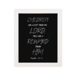 Bible wall art featuring the quote 'Children are a gift from the LORD, they are a reward from Him' from Psalm 127:3. hung on the wall in a white frame