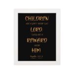 Bible wall art featuring the verse 'Children are a gift from the LORD' in golden text on a black background. hung on the wall in a white frame