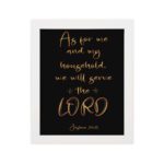 Joshua 24:15 Bible wall art with golden text on a black background, emphasizing LORD in a decorative font. hung on the wall in a white frame