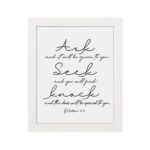 Matthew 7:7 Bible wall art in elegant cursive, highlighting Ask, Seek, and Knock on a white background. hung on the wall in a white frame