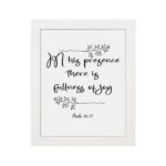 In His Presence There Is Fullness of Joy in a black script font with decorative branches and Psalm 16:11 on a white background - Christian wall art. hung on the wall in a white frame