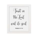 Trust In The Lord And Do Good Psalm 37:3 black cursive text on white background Christian wall art hung on the wall in a white frame