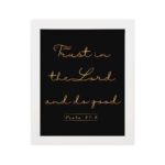 Trust In The Lord And Do Good Psalm 37:3 golden text on black background Christian wall art hung on the wall in a white frame