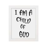 I Am a Child of God Bible wall art with bold black text on a white background, framed by a subtle black border. Wall Art hung on the wall in a white frame