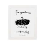 Infidu The Goodness Of God Endures Continually Psalm 52:1 Bible Wall Art with black text and brushstroke design on white background. Wall Art hung on the wall in a white frame