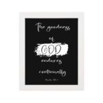 Infidu The Goodness of God Endures Continually Psalm 52:1 Bible Verse Wall Art with white text on black background. Wall Art hung on the wall in a white frame