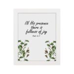 In His Presence There Is Fullness of Joy - Psalm 16:11 Bible Verse Wall Art with Green Leaf Design on White Background Wall Art hung on the wall in white frame