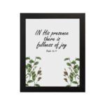 In His Presence There Is Fullness of Joy - Psalm 16:11 Bible Verse Wall Art with Green Leaf Design on White Background Wall Art hung on the wall in black frame