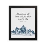 Psalm 2:12 Bible Verse Wall Art with deep blue mountain range design. Wall Art hung on the wall in a black frame