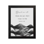 Psalm 2:12 Bible wall art featuring a black-and-white mountain landscape with the verse Blessed are all those who put their trust in Him. Wall Art hung on the wall in black frame