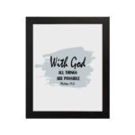 With God All Things Are Possible Matthew 19:26 Bible Verse Wall Art with black text and light blue brushstroke on white background. Wall Art hung on the wall in a black frame