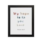 Infidu My Hope Is In You Lord Psalm 39:7 Bible Wall Art with colorful, playful text on a white background Wall Art hung on the wall in a black frame