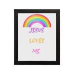 Infidu Jesus Loves Me Bible Wall Art with rainbow arc and colorful text in purple, yellow, and pink fonts Wall Art hung on the wall in a black frame