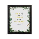 Psalm 46:1 Bible Wall Art with gold and black text, leafy green borders, and a white background. Wall Art hung on the wall in black frame