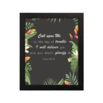 Psalm 50:15 Bible Verse Wall Art with white text, tropical leaves, and black background. Wall Art hung on the wall in a black frame