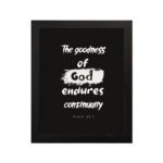 Infidu The Goodness Of God Endures Continually Psalm 52:1 Christian wall art with bold white text on a black background. Wall Art hung on the wall in a black frame