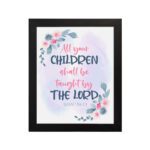 Christian wall art with Isaiah 54:13, featuring 'All Your Children Shall Be Taught By The Lord' in pastel watercolor with floral elements. Wall Art hung on the wall in a black frame